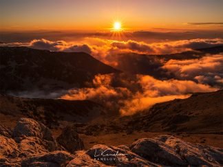 Sunset over the clouds landscape